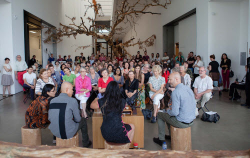 From Left: Cai’s Interpreter, Cai Quo-Qiang, May King Tsang and Russell Storer, curator of QAGOMA, speaking at the Opening Weekend of Falling Back to Earth (Photographer: Brodie Standen, Image Courtesy: Queensland Art Gallery | Gallery of Modern Art)