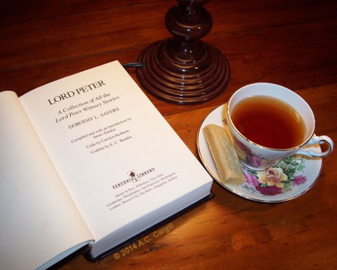 A good book, a shortbread cookie, and a tasty cuppa! That’s living! (Photo by A.C. Cargill, all rights reserved)